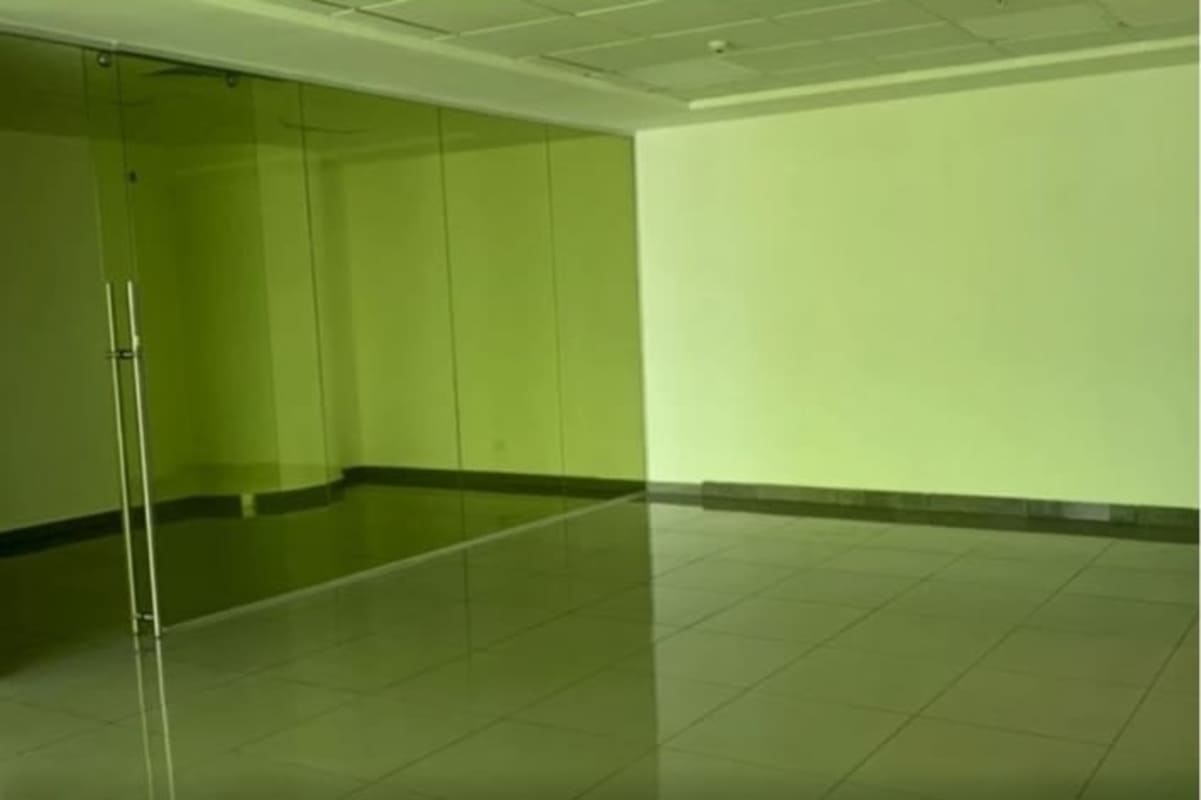 Vacant open office area with glass dividers inside PH BICSA Financial Center in Panama City