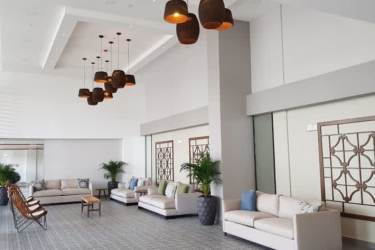 Elegant lobby at Royal Palm Playa Gorgona overlooking ocean with modern finishings