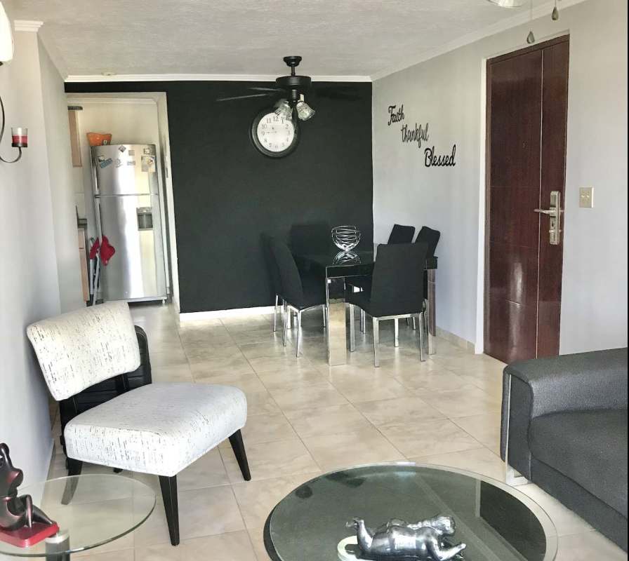 Kitchen with wood cabinets, granite countertop and appliances in PH Los Girasoles Parque Lefevre