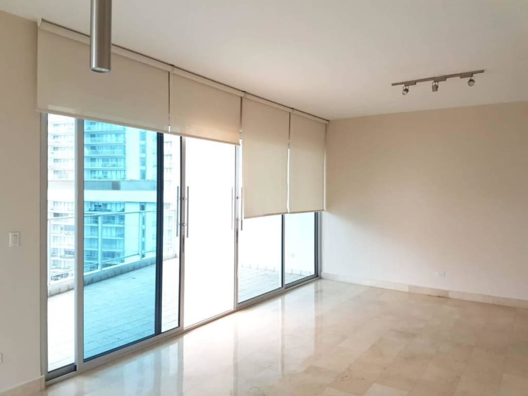 Luxury condominium lobby with marble floors and concierge desk in Pacific Village Panama