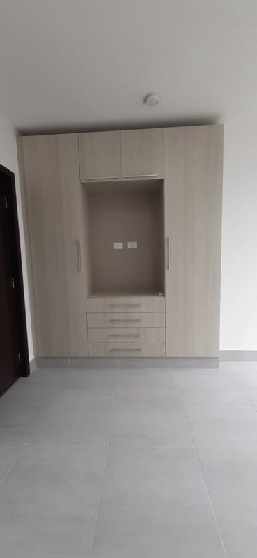 Private office room with large windows and city skyline view in The Office One Tower Panama City