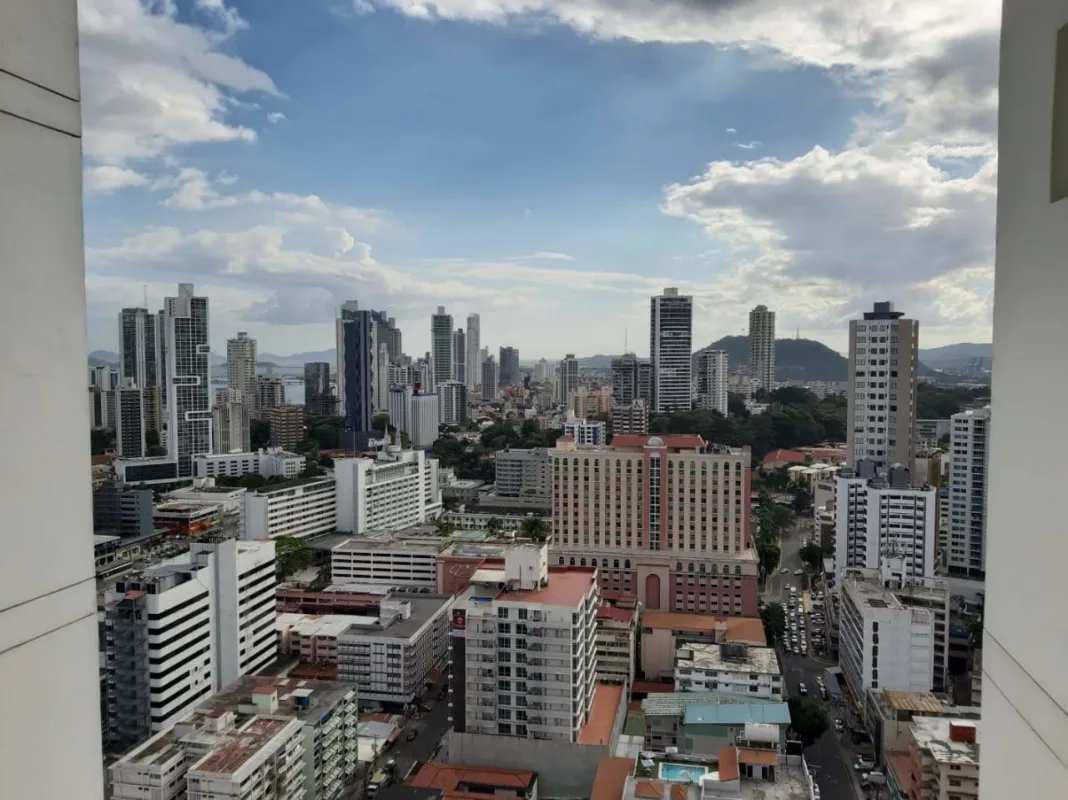 Furnished bedroom with window skyline view in penthouse at PH El Cangrejo