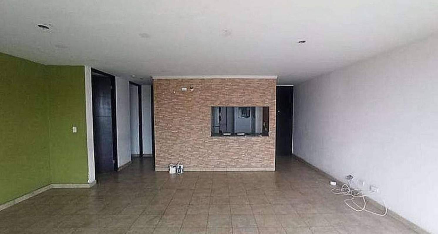 Living room with open kitchen brick backsplash PH Cosmopolitan Tower Panama