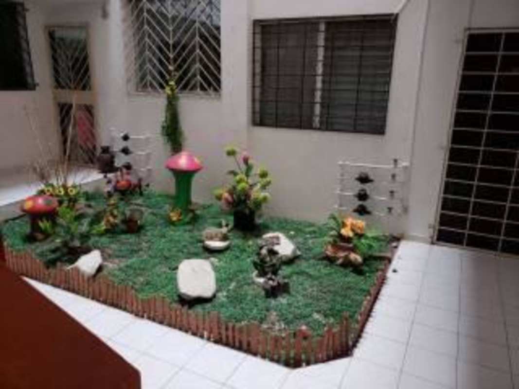 Indoor patio with garden decor artificial grass potted plants in affordable Bella Vista apartment for sale