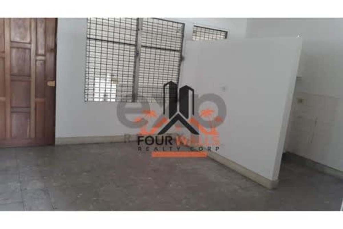 Functional kitchenette area with built-in sink and ventilation window Panama condo