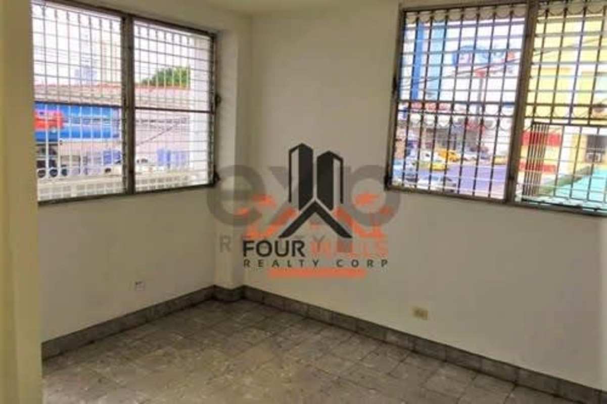 Versatile room with large barred windows & city view Panama apartment