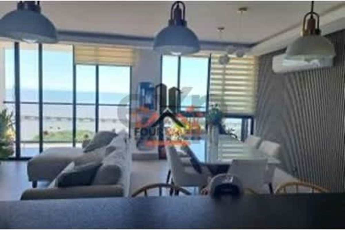Spacious living and dining area with floor-to-ceiling ocean view windows PH Victory Wellness Panama