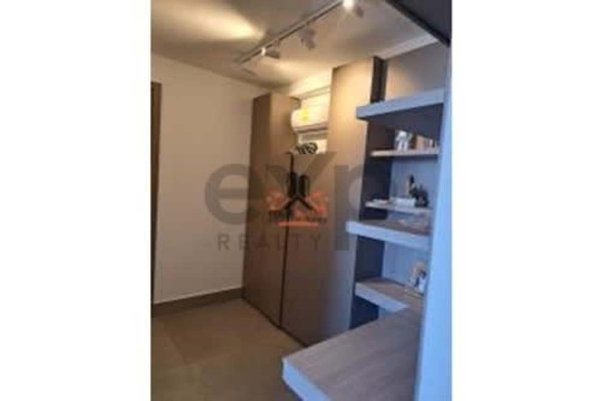 Elegant walk-in closet with built-in storage and AC PH Victory Wellness Panama City