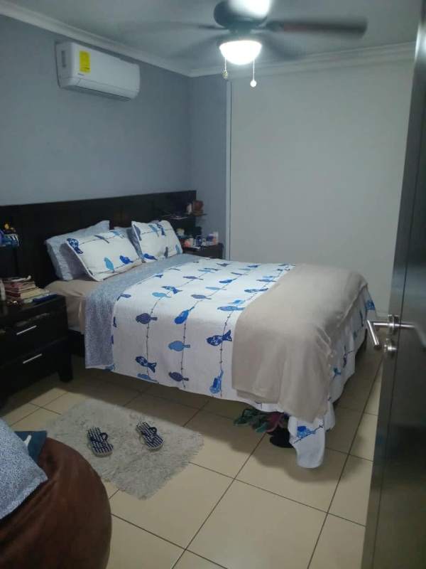 Bedroom with ceiling fan double bed AC unit PH Dos Mares Tower Panama