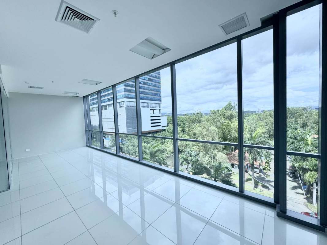 Minimalist bright empty office with glass walls windows panoramic city view Costa del Este Panama