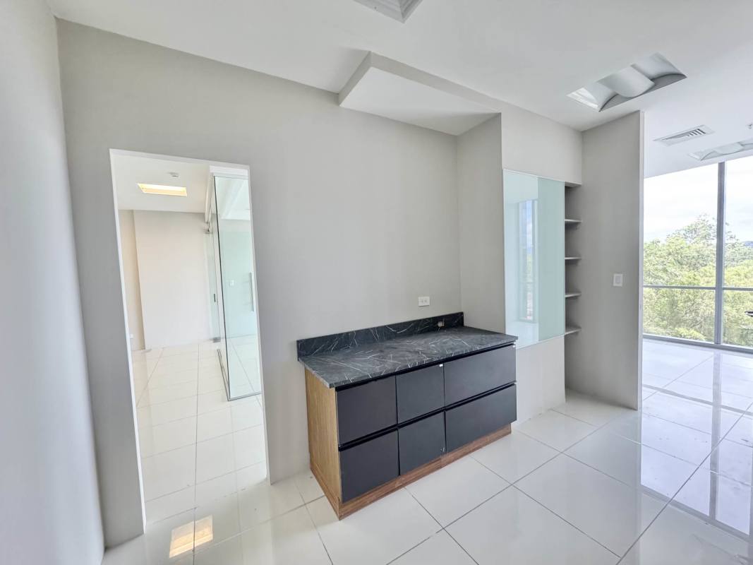 Bright dressing or vanity area with large windows black marble countertop in Costa del Este commercial building Panama