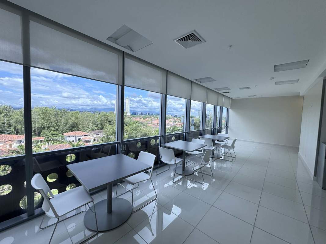 Office break room lounge with panoramic windows, city skyline view, Costa del Este Panama