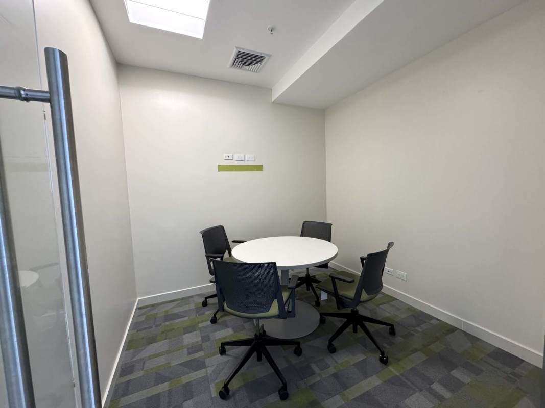 Cozy small conference room with round table and glass wall in Costa del Este Panama