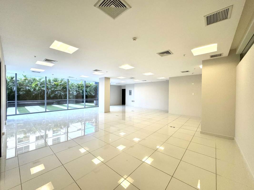 Spacious open office with white floor tiles and large windows in PH Financial Park Costa del Este Panama