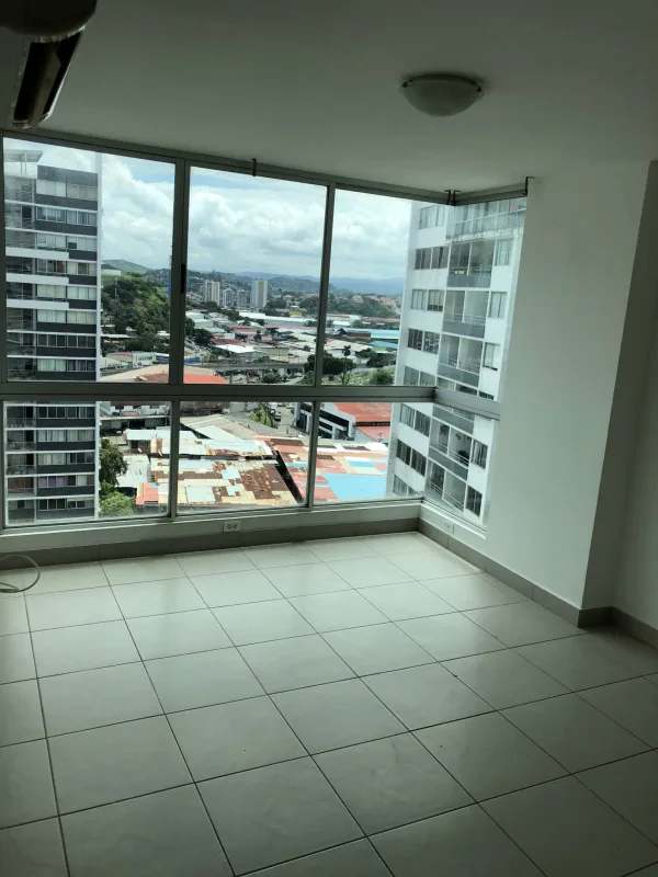 Master bedroom with built-in closet and window in Central Park Tower 12 de Octubre Panama