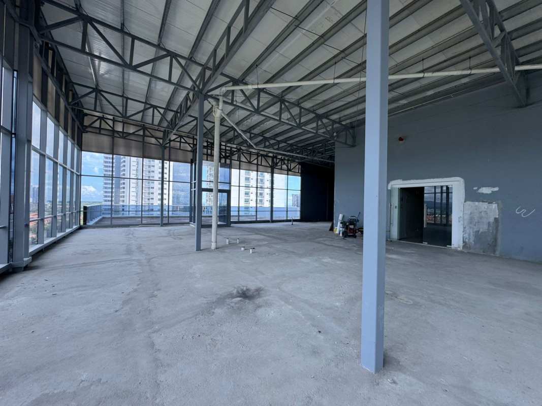 Large open commercial shell office with ceiling height views of Pacific Ocean in Aquamarina Tower Costa del Este