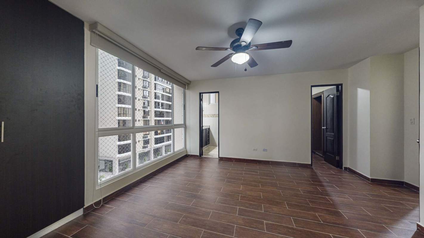 Bright bedroom with built-in wardrobes, large windows and city view in Sophia Tower Obarrio Panama