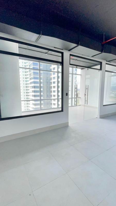 Floor-to-ceiling windows in commercial office space showing downtown Panama