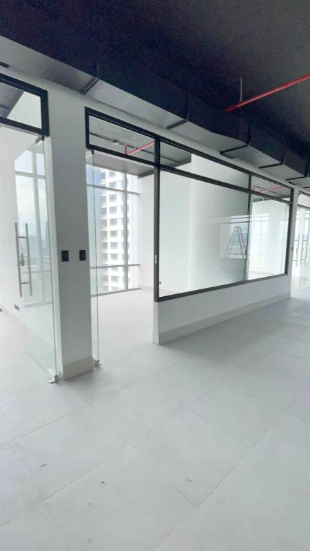 Reception lobby area of office space with glass walls and city views in Costa del Este Panama