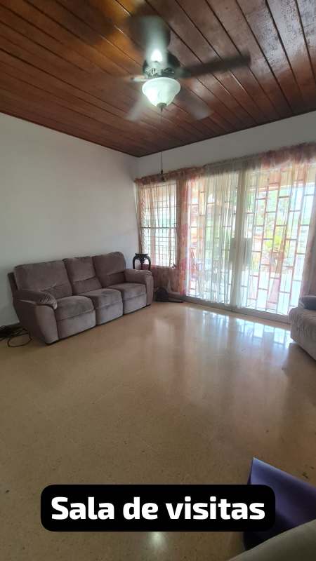 Spacious bedroom with large wooden closet and ceramic floors in Betania house