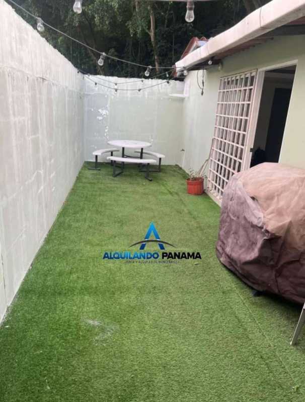 Private outdoor backyard patio with artificial grass fenced walls house for sale in Condado del Rey Panama