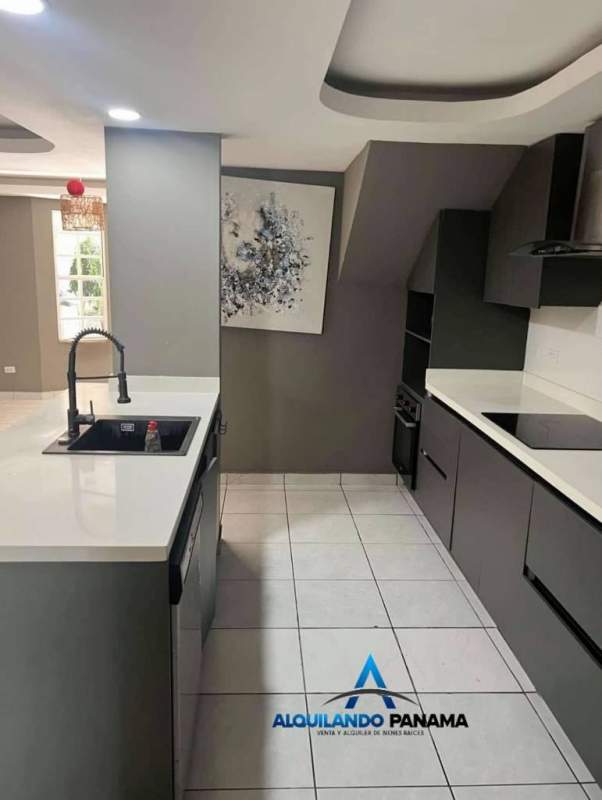 Bright tiled living room with large windows and decorative ceiling Condado del Rey house for sale Panama