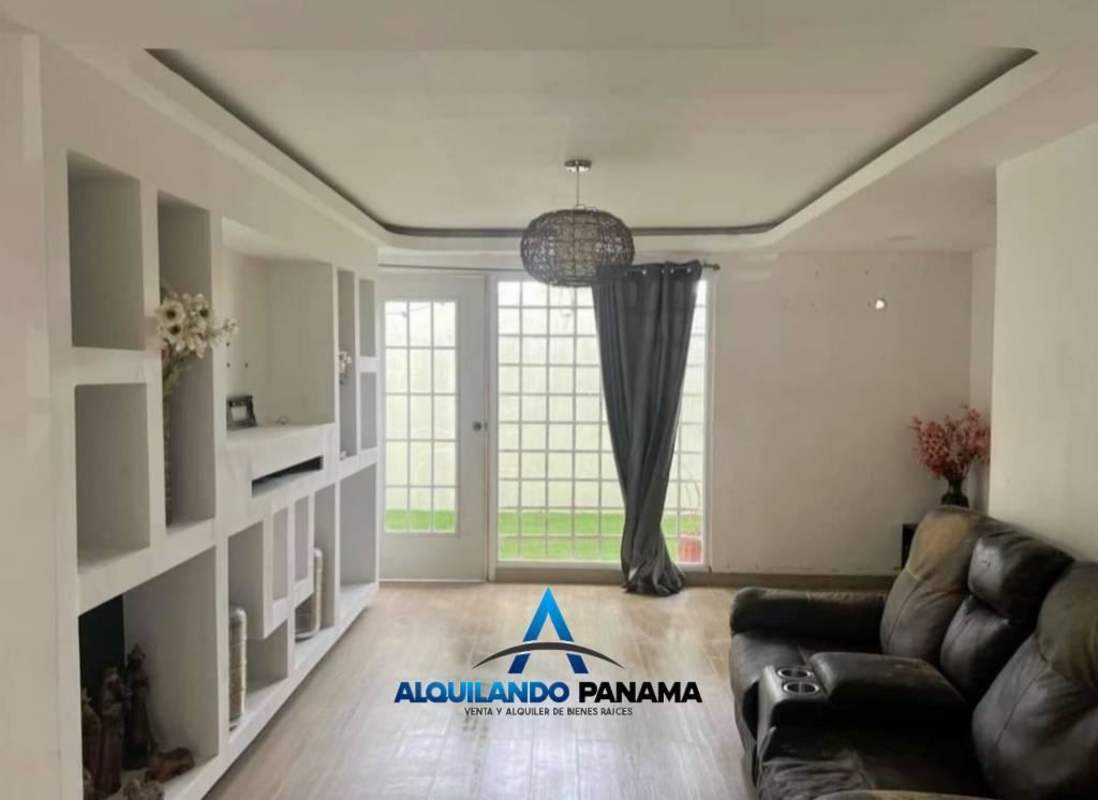 Living room with tile floor, French doors, ceiling design in Panama house Condado del Rey