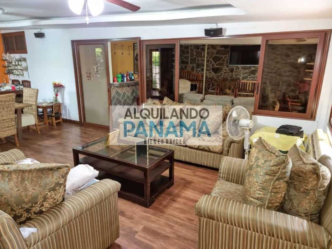 Bedroom with air conditioning, wood beam ceiling, large windows in Betania Panama home