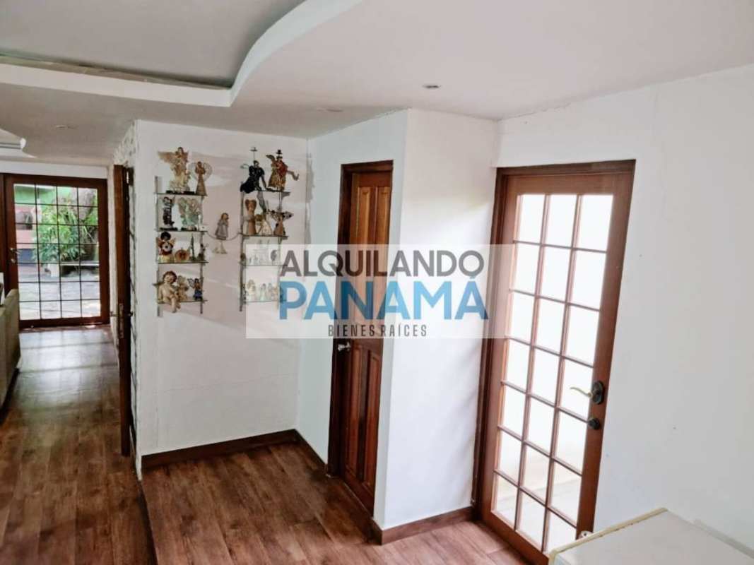 Spacious hallway with wood floors and glass decorative doors Betania Panama City