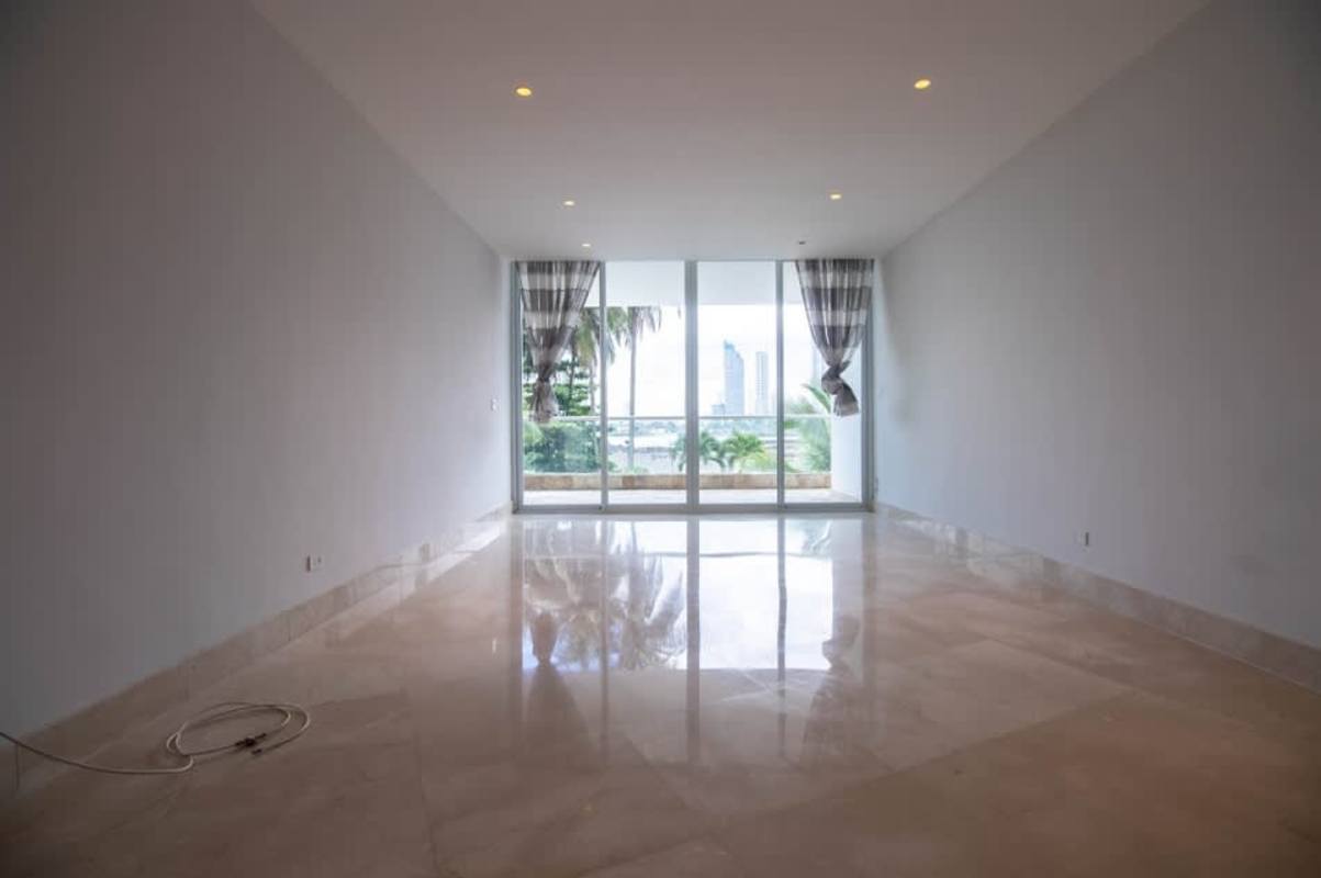 Modern apartment with large windows and terrace access overlooking Panama Bay at PH Miradores Punta Paitilla