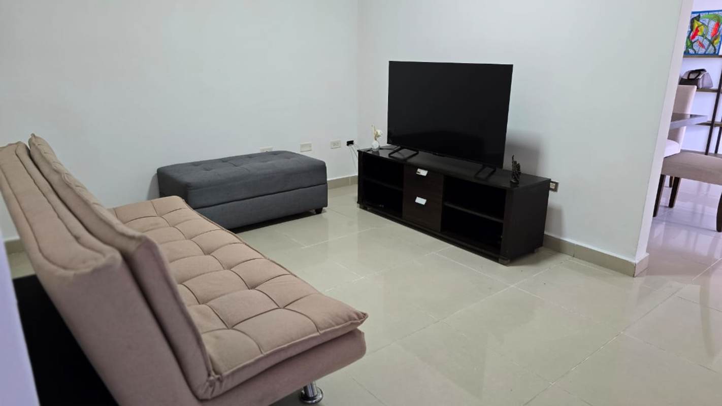 Minimalist living room with sofa, TV, open layout PH Pacific Sea Coco del Mar