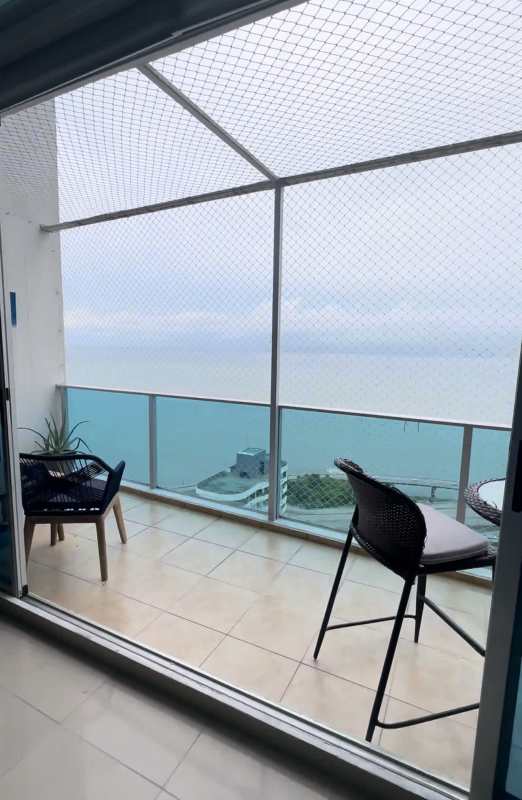 Modern duplex living room with double-height ceiling and ocean views at PH Cabomarzo San Francisco