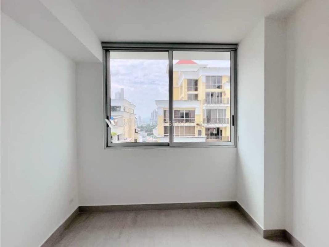 Modern bedroom with natural light and panoramic windows overlooking Panama City in PH Urbana