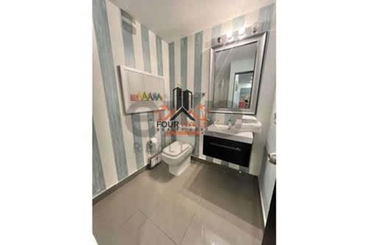 Indoor swimming pool with lounge seating in PH Quartier 74 apartment tower San Francisco Panama