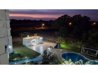 Bedroom with large window and balcony access ocean view Playa Blanca Resort Panama