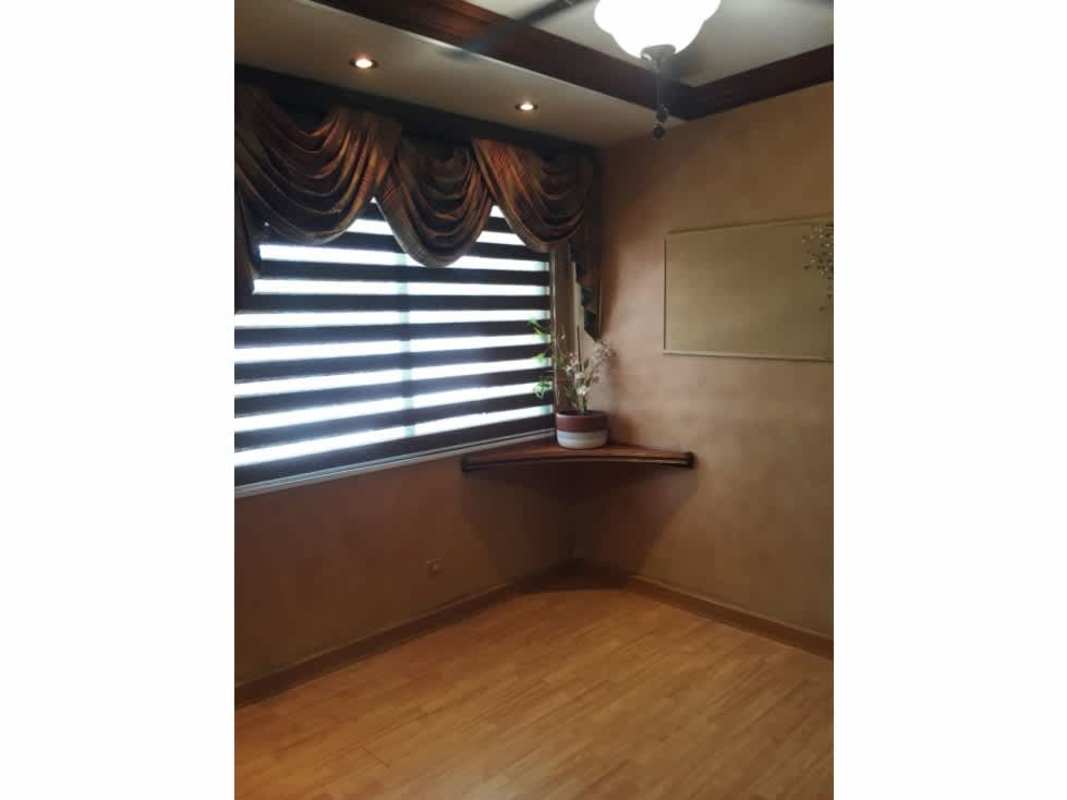 Bathroom with glass enclosed shower and wood cabinets PH Brisas Obarrio Panama