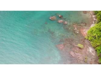 Turquoise water and dense jungle coastline beachfront lot Cebaco Panama for sale
