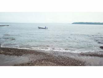 Waterfront beach and rocky coastline of development land on Cebaco Island Panama