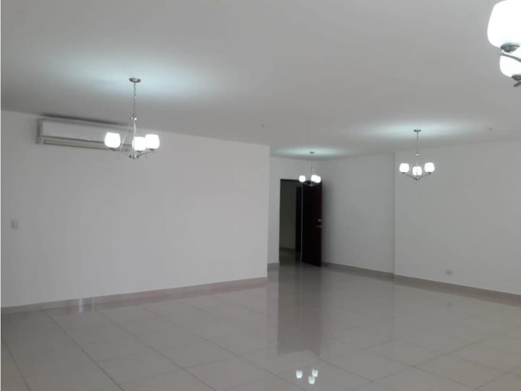 Contemporary kitchen with granite countertops, stainless steel refrigerator and ample storage in PH Brisa Marina Panama