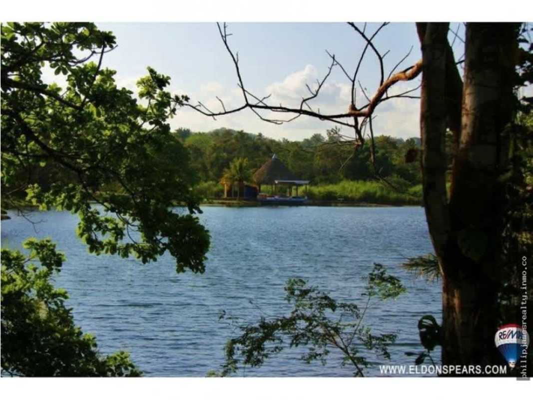 Lakefront landscape with gazebo and lush greenery at Brisas de los Lagos Panama