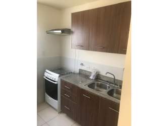 Kitchen with granite countertops and modern cabinetry in house for sale Playa Dorada Panama
