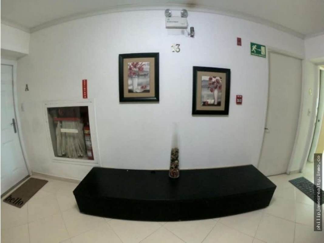 Spacious dining room with contemporary design and ceramic tile floors in Royal Pacific apartment Panama City