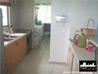 Garden area with white gazebo blue roof tropical landscaping at Playa Blanca Resort Panama