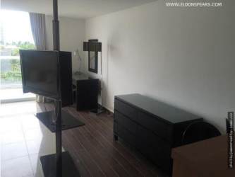 Modern kitchenette with granite countertop in Playa Blanca Town Center studio apartment