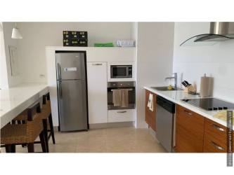 Resort condo second bedroom with two full beds, modern decor at Nikki Beach Playa Blanca