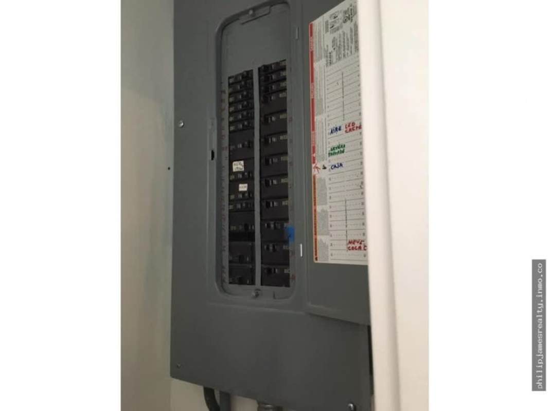 Modern electrical breaker panel with labelled switches in PH Sortis Hotel commercial space Obarrio Panama