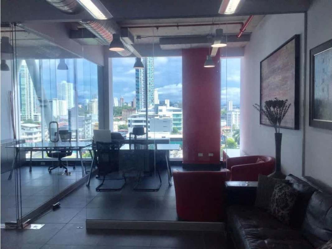 Modern meeting area with glass partitions, urban skyline view PH Office 77 San Francisco Panama
