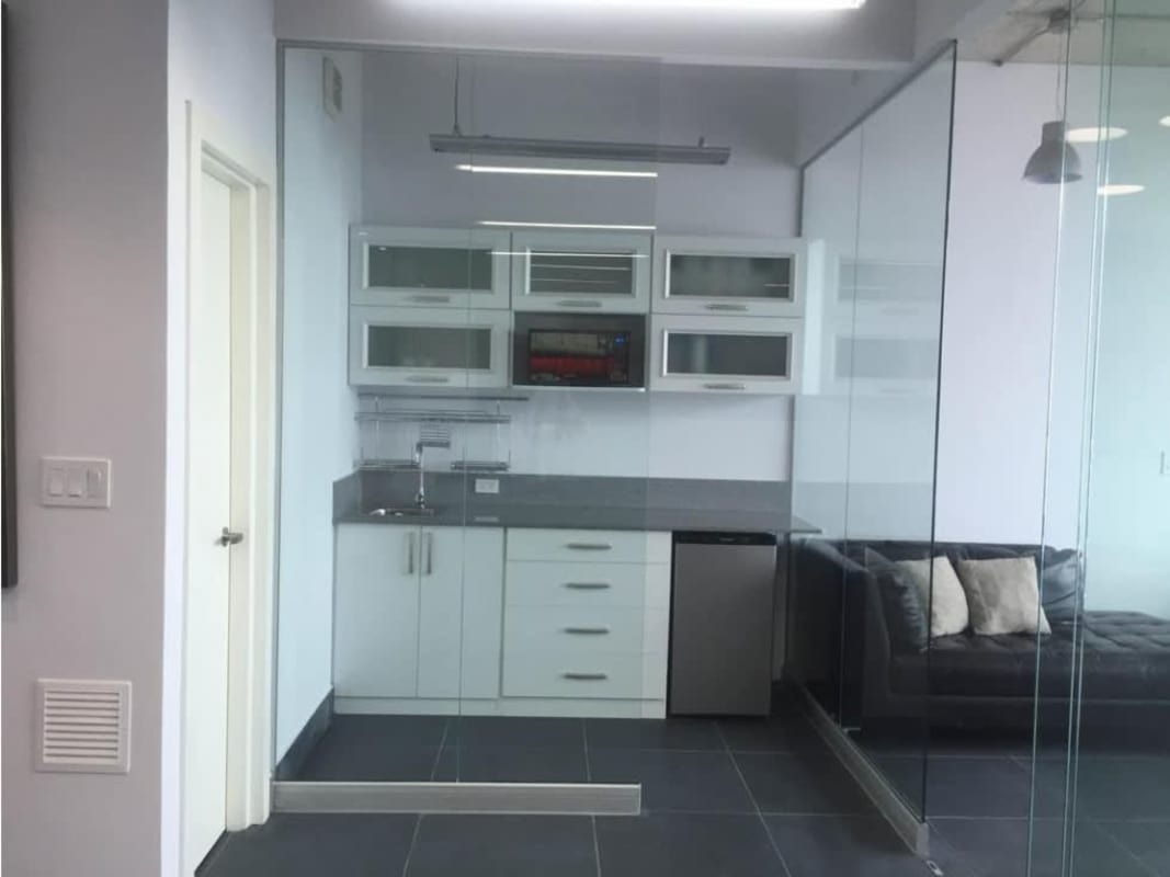 Compact kitchenette in PH Office 77 with cabinetry, sink, tiled floor San Francisco Panama