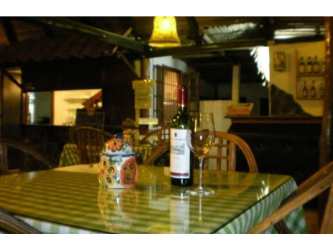 Rustic interior dining with wood beams and cozy atmosphere San Carlos Panama