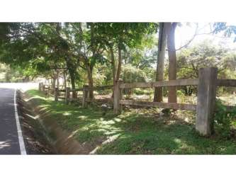 Wooden fence roadside access to large flat lot close to Pacific beach